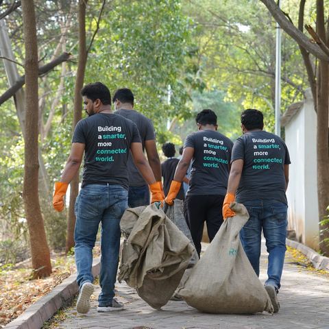 Volunteers hauling full sacks down the Nerella Lake walkway